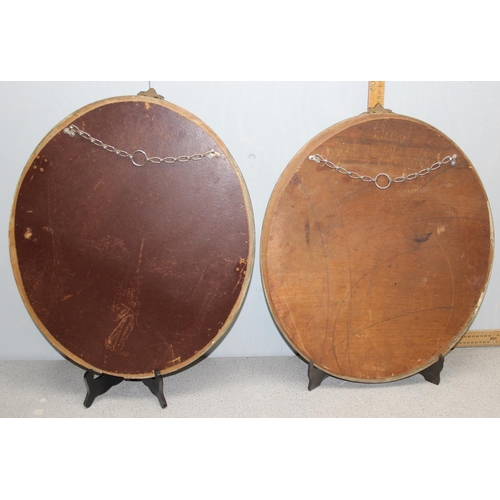 460 - A pair of vintage oval gilt framed wall mirrors with rococo style details, approx 57cm tall