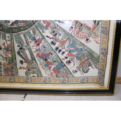 448 - A large framed silk scarf or panel depicting various armies routes to a central vignette, marked Arc... 