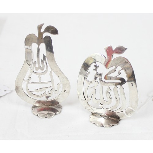 1040 - A pair of Islamic silver pierced items formed as a pear and an apple with Islamic script, bearing Is... 