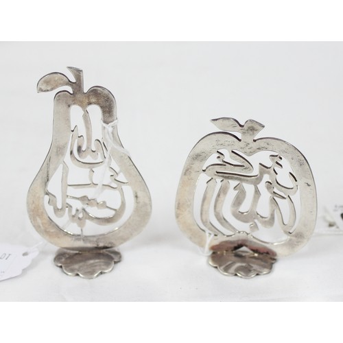 1040 - A pair of Islamic silver pierced items formed as a pear and an apple with Islamic script, bearing Is... 