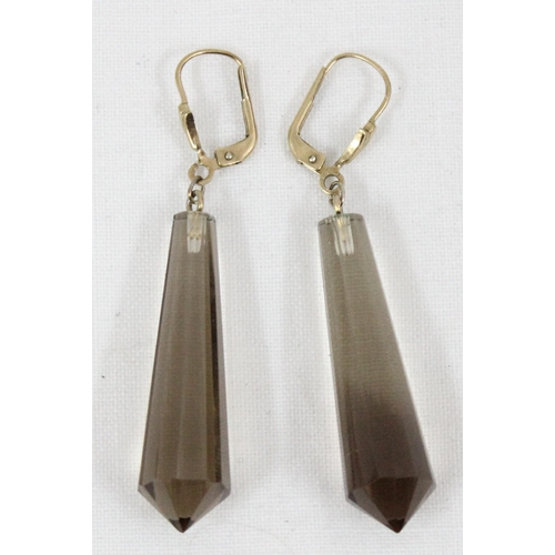 1133 - A pair of German 333 (8ct gold) and smokey crystal facet cut earrings