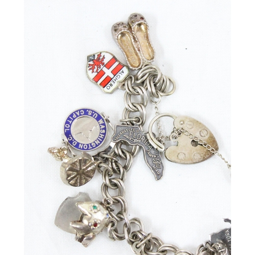 1134 - Vintage silver charm bracelet and various charms, approx 46.83g gross