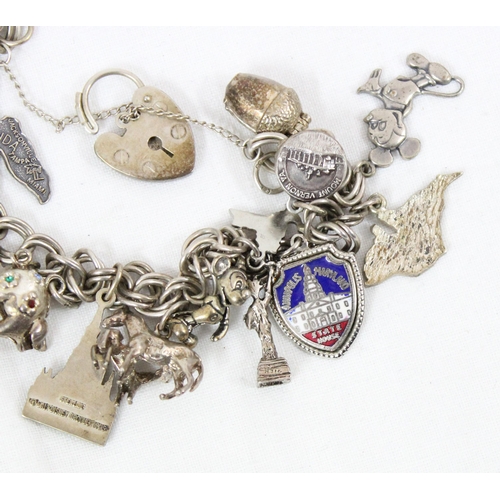 1134 - Vintage silver charm bracelet and various charms, approx 46.83g gross