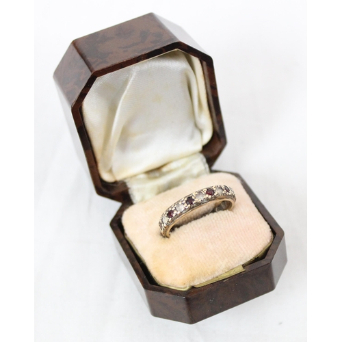 1142 - 9ct gold eternity ring set with onyx and white stone, approx size O, approx 2.41g gross, in box