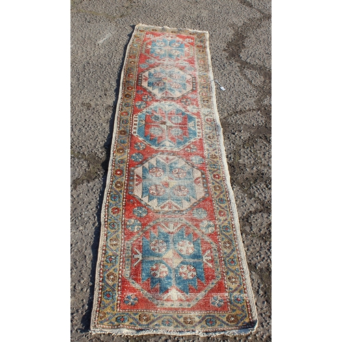 202 - A vintage worn hall runner rug, approx 270cm x 68cm