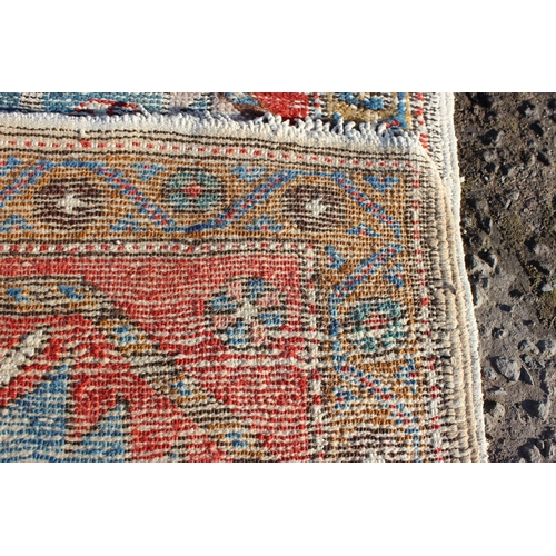 202 - A vintage worn hall runner rug, approx 270cm x 68cm