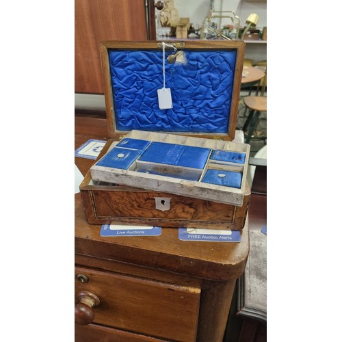 276 - An antique walnut inlaid sewing box with fitted interior