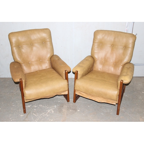 30 - A pair of Scandinavian style retro button backed armchairs