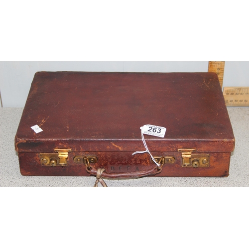 291 - A small vintage leather travelling writing case with key