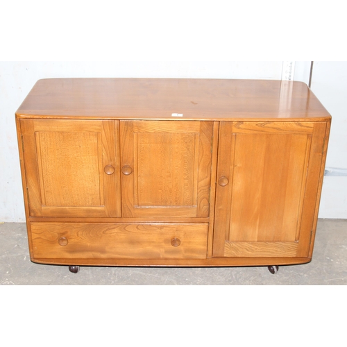 1 - A retro Ercol Windsor model 366 elm sideboard, approx 115cm wide