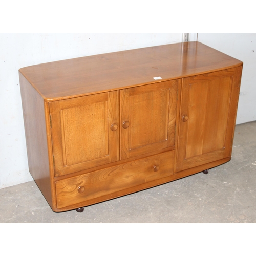 1 - A retro Ercol Windsor model 366 elm sideboard, approx 115cm wide