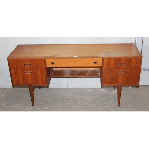 10 - A retro Nathan desk with 5 drawers, approx 153cm wide