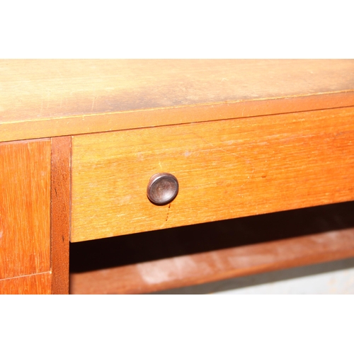 10 - A retro Nathan desk with 5 drawers, approx 153cm wide