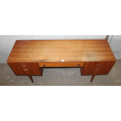 10 - A retro Nathan desk with 5 drawers, approx 153cm wide