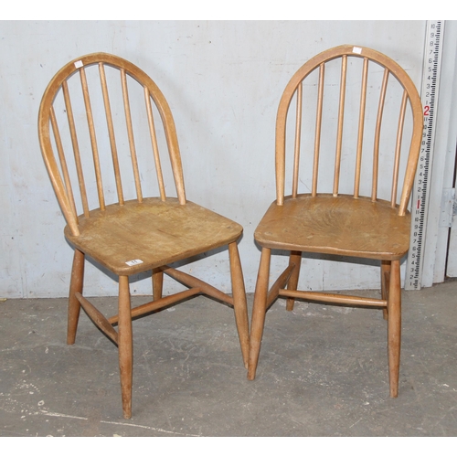 11 - A pair of retro Ercol blonde hoop back dining chairs, blonde finish