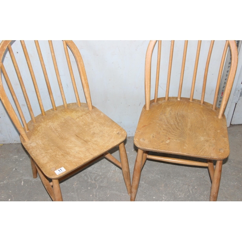 11 - A pair of retro Ercol blonde hoop back dining chairs, blonde finish