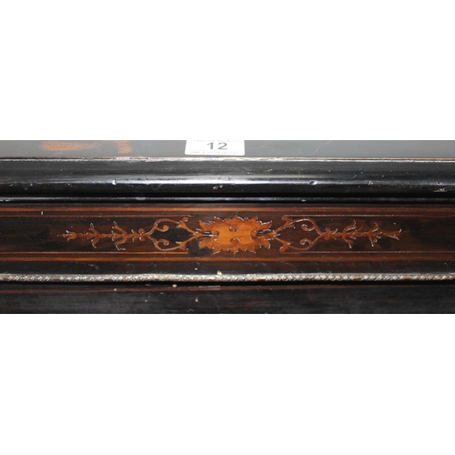 12 - A 19th century pier cabinet with inlay and brass mounts and ebonised finish, approx 76cm wide