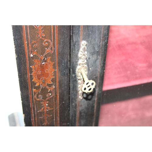 12 - A 19th century pier cabinet with inlay and brass mounts and ebonised finish, approx 76cm wide