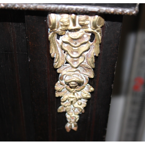 12 - A 19th century pier cabinet with inlay and brass mounts and ebonised finish, approx 76cm wide