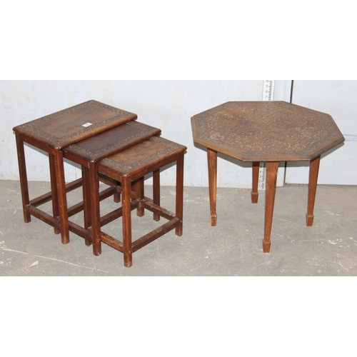 15 - A vintage carved Indian hardwood nest of tables and a similar carved wooden octagonal table