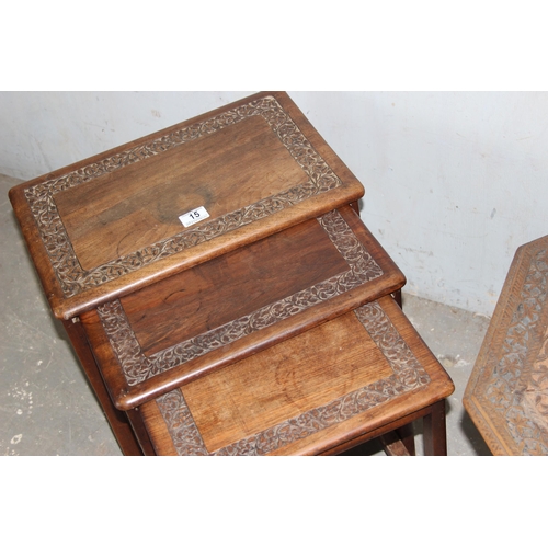 15 - A vintage carved Indian hardwood nest of tables and a similar carved wooden octagonal table