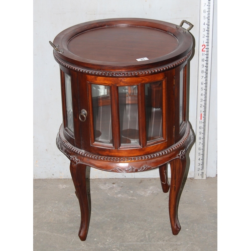 21 - An antique style drum serving table with glazed panels and removable tray top, approx 53cm in diamet... 