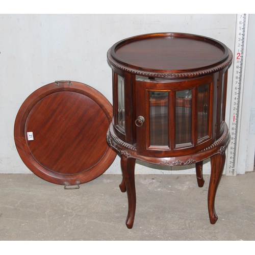 21 - An antique style drum serving table with glazed panels and removable tray top, approx 53cm in diamet... 