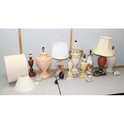 235 - 9 assorted vintage lamps, pottery, alabaster, wooden etc, some shades