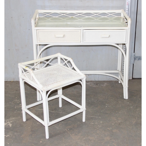 27 - A retro white painted bamboo effect and Bergere desk and stool, approx 105cm wide