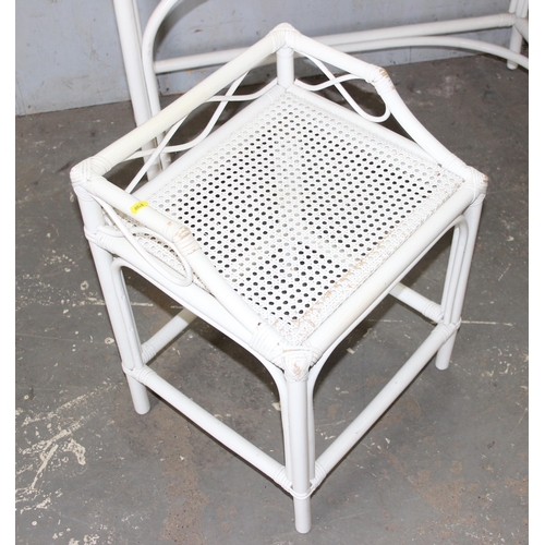 27 - A retro white painted bamboo effect and Bergere desk and stool, approx 105cm wide