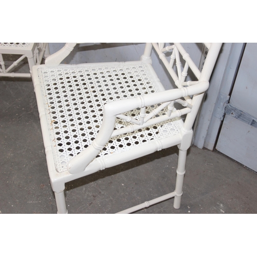 28 - An Aesthetic Movement style white painted bamboo effect chair and matching footstool, both with Berg... 