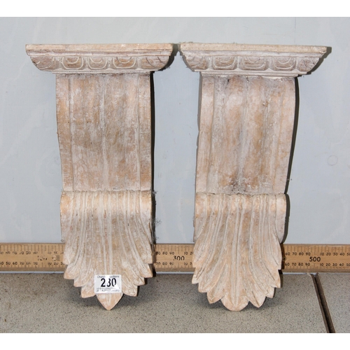 280 - A pair of Italian style carved wooden wall brackets, approx 37cm tall each