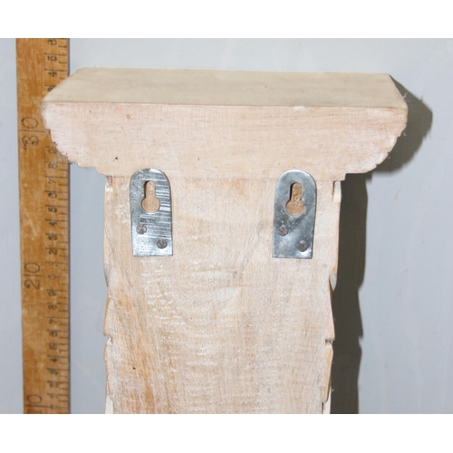 280 - A pair of Italian style carved wooden wall brackets, approx 37cm tall each