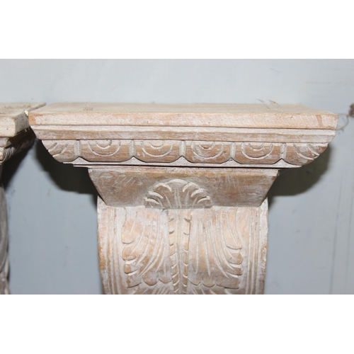 281 - A pair of Italian style carved wooden wall brackets, approx 37cm tall each