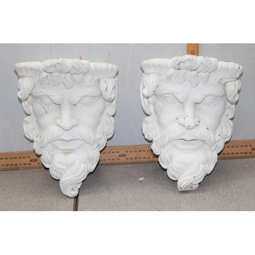 284 - A pair of white painted plaster wall brackets formed as the head of a classical god, approx 25cm tal... 