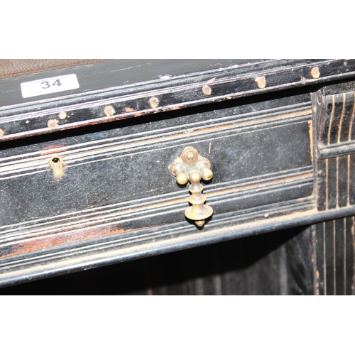 34 - A Victorian ebonised pedestal desk with 9 drawers and brass drop handles, approx 108cm wide