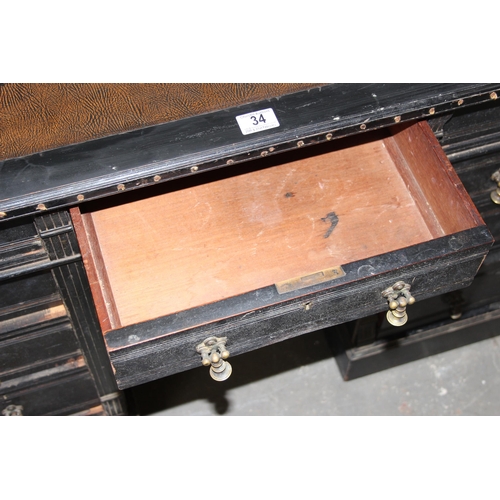 34 - A Victorian ebonised pedestal desk with 9 drawers and brass drop handles, approx 108cm wide