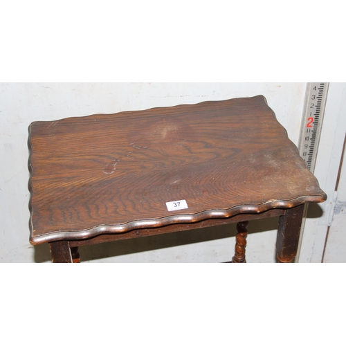 37 - An early 20th century oak table with barleytwist legs