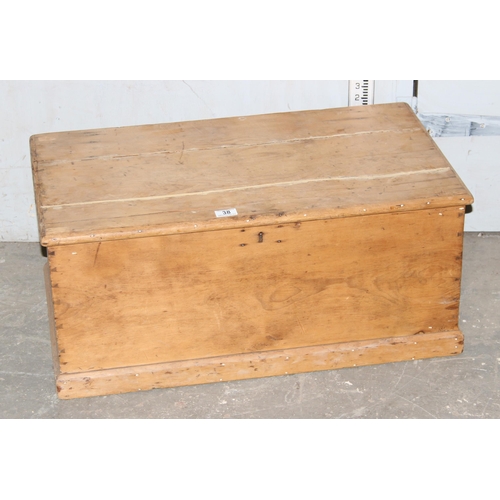 38 - An antique pine trunk, approx 80cm wide