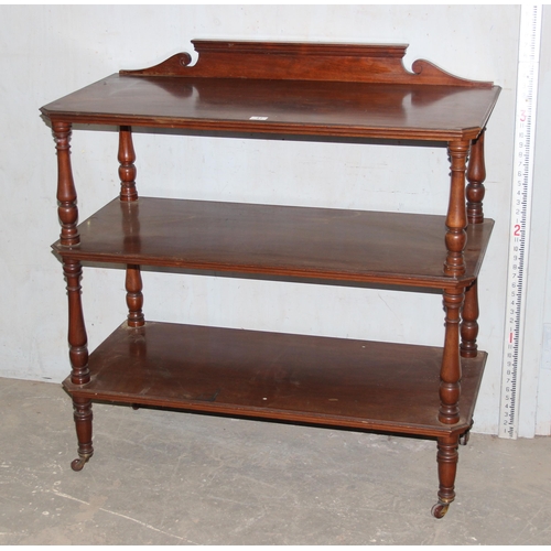 41 - A Victorian mahogany 3 tier buffet stand with turned supports and brass and ceramic castors, approx ... 