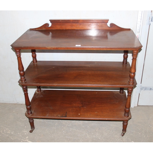 41 - A Victorian mahogany 3 tier buffet stand with turned supports and brass and ceramic castors, approx ... 