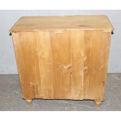 43 - A Victorian stripped pine 2 over 3 chest of drawers with bun handles, approx 95cm wide