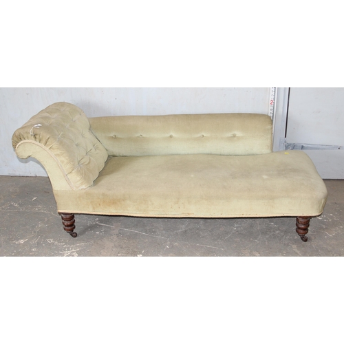 45 - A Victorian button back chaises longue with turned mahogany legs and light green upholstery