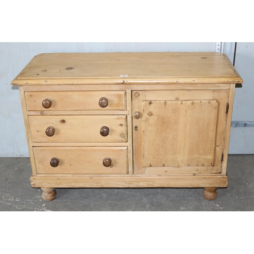 50 - A Victorian pine sideboard comprising of 3 drawers and a cupboard, with bun handles and bun feet, ap... 