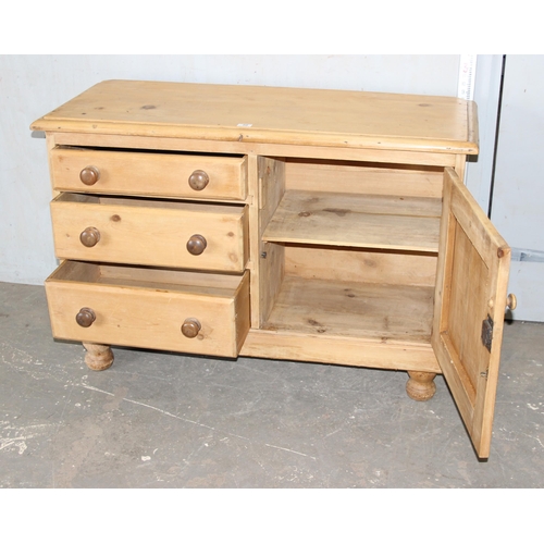 50 - A Victorian pine sideboard comprising of 3 drawers and a cupboard, with bun handles and bun feet, ap... 