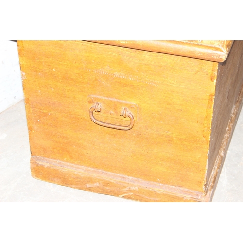 52 - An antique scumbled pine flat topped box with iron handles, approx 80cm wide