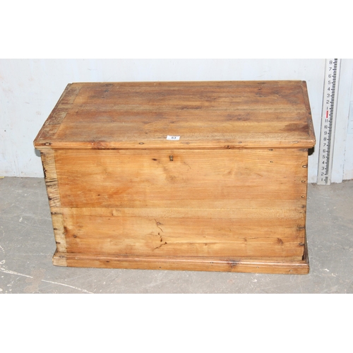 53 - An antique pine flat topped box with iron handles, approx 86cm wide