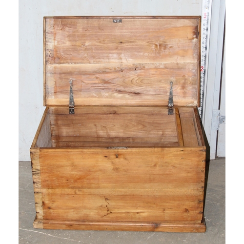 53 - An antique pine flat topped box with iron handles, approx 86cm wide