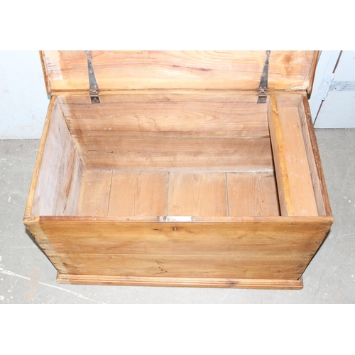 53 - An antique pine flat topped box with iron handles, approx 86cm wide