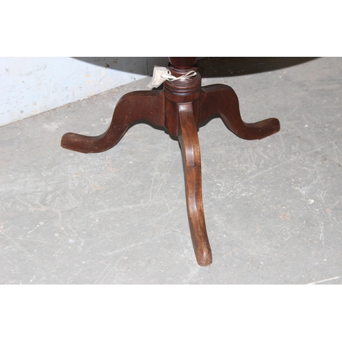 57 - A 19th century mahogany tilt top table, approx 75cm in diameter